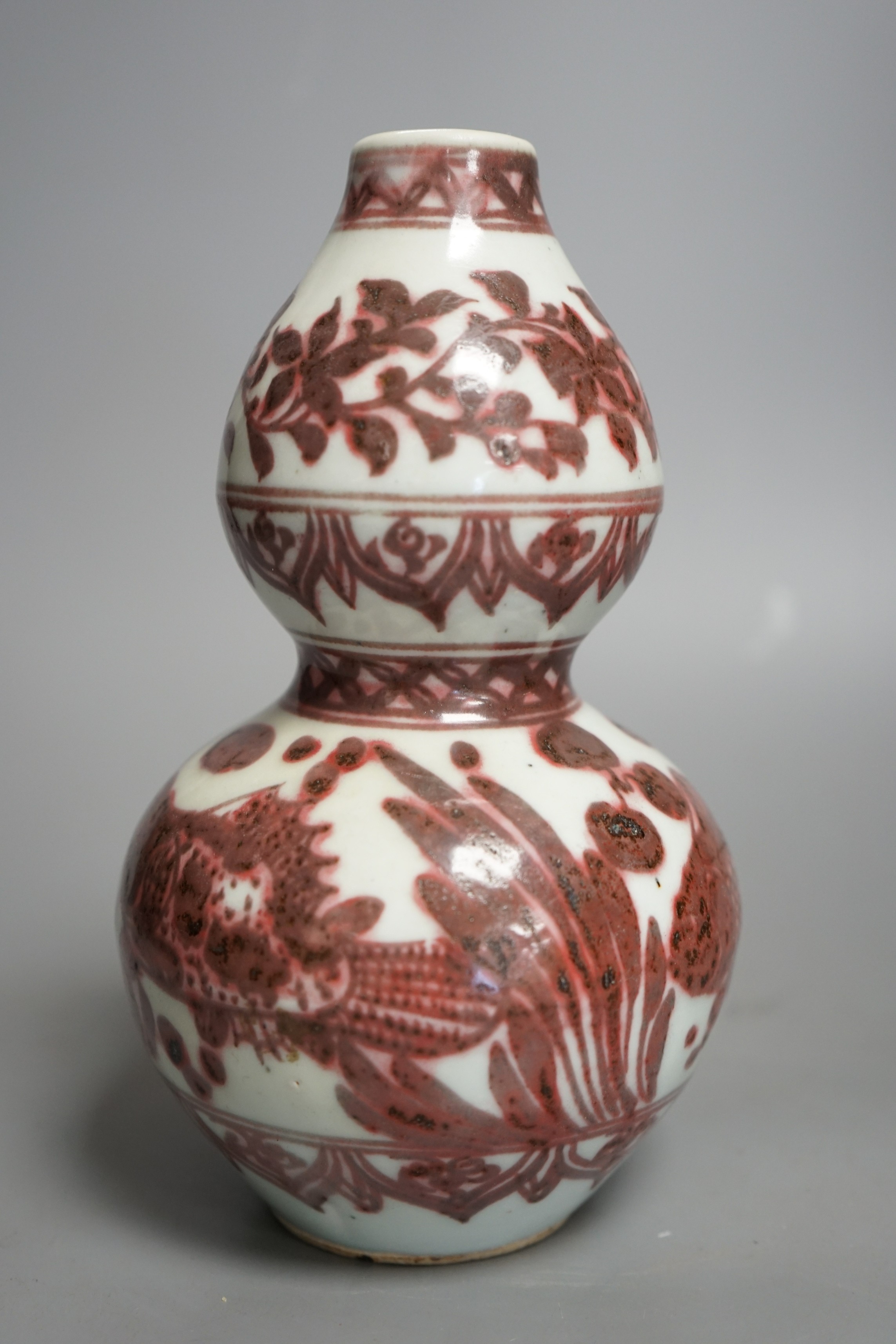 A Chinese underglaze copper red double gourd vase, 20cms high